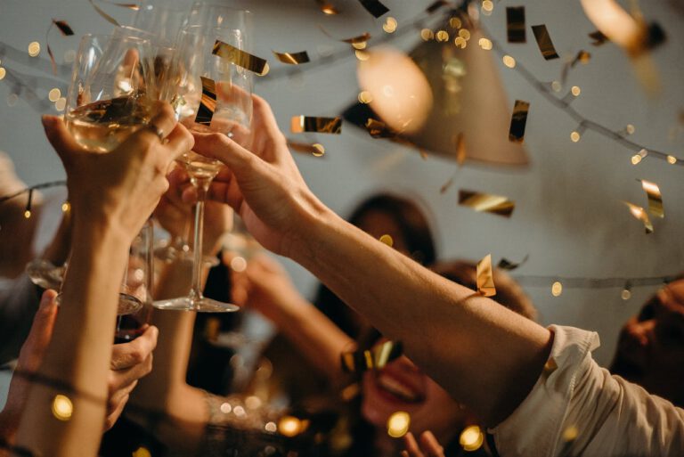 People toasting with champagne glasses at a celebration